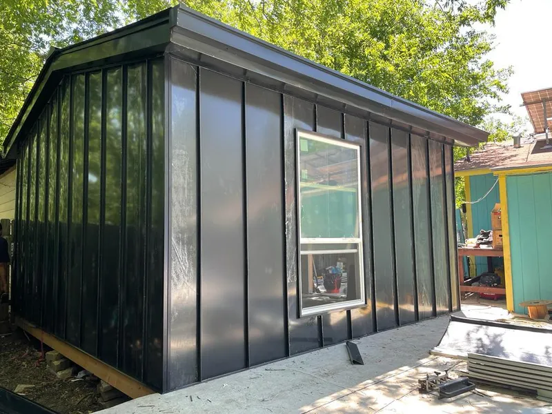 Black standing seam metal wall panels for Roof Inspection in Winnetka